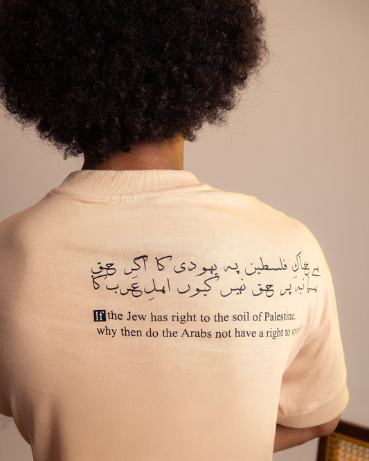 Person wearing a beige shirt with Arabic text and a question about Palestine.